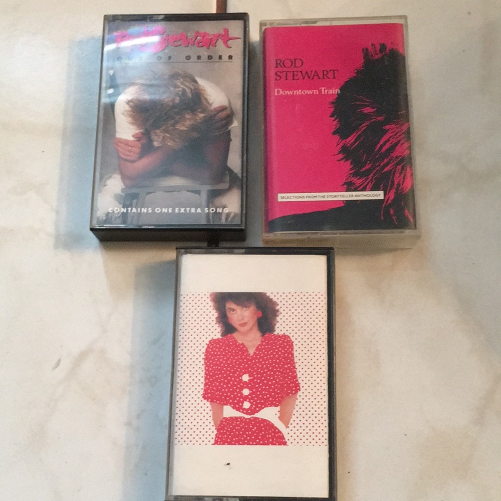 Three music cassettes of Rod Stewart and Linda Ronstadt